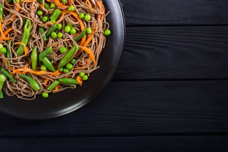 Soba noodles salad . Asian food background . Japanese bowlの写真素材