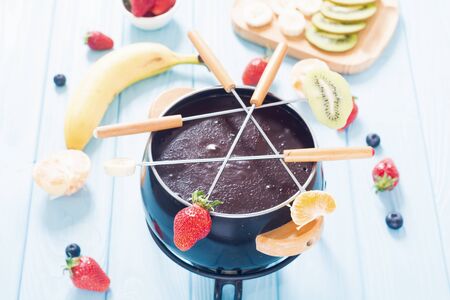 Dessert . Chocolate fondue with fruit and berries . Food backgroundの写真素材