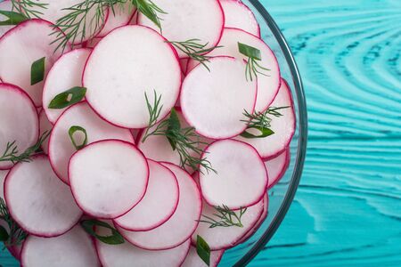 Healthy vegetarian radish salad with green onion and dill .の写真素材