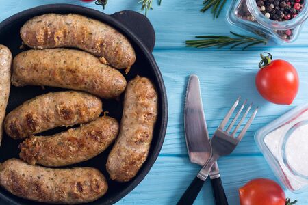 Grilled sausages with tomatoes , pepper and rosemary`. BBQ food backgroundの写真素材