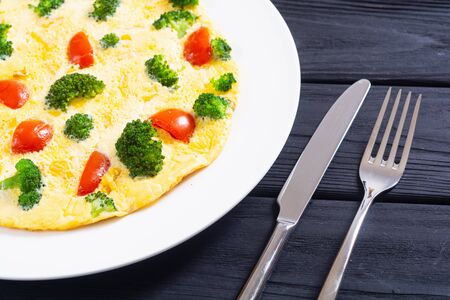 Italian healthy breakfast  . Omelette with broccoli and cherry tomatoesの写真素材