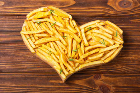 French fries with rosemary and ketchup. Fastfood background. Heart loveの写真素材