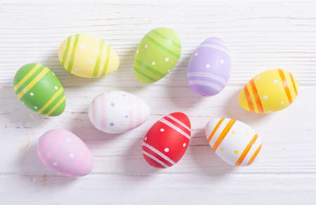 Colorful easter eggs collection on wooden background