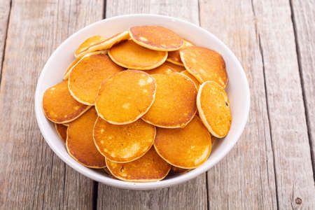 Mini pancakes. Delicious breakfast. Food background