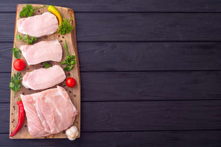 Raw pork fillet with spices and herbs. Ready to preparationの写真素材
