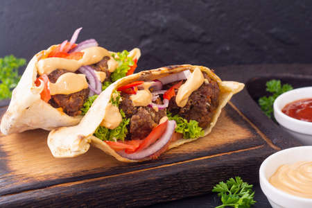 Pita with falafel, paprika and onion. Traditional arabian and israel foodの写真素材