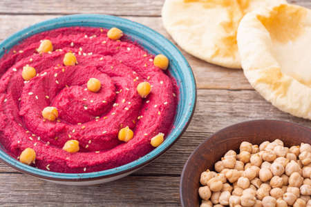 Declicious food from chickpea - beetroot hummus. Israel and arabic kitchenの写真素材