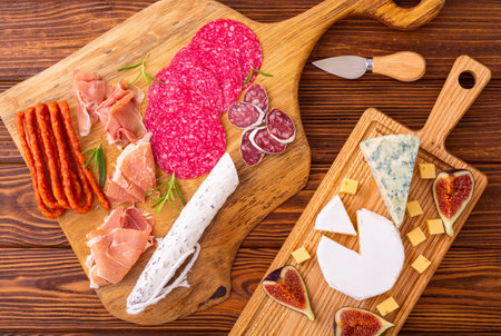 Board with meat, sausages and cheese. Top view food backgroundの写真素材