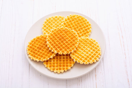 Tasty breakfast. Sweet golden Belgian waffles. food backgroundの写真素材