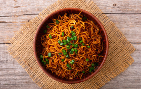 Fried Instant noodles with green onion and soy sauce, traditional Asian food. Top viewの写真素材