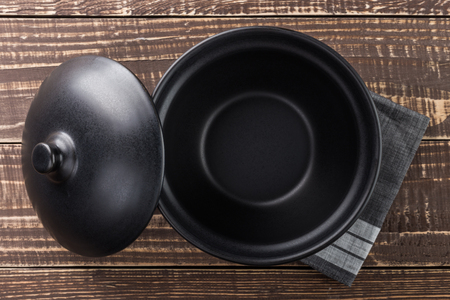 black bowl blank space on wood top viewの写真素材