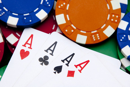 poker, four aces over a background with casino chips