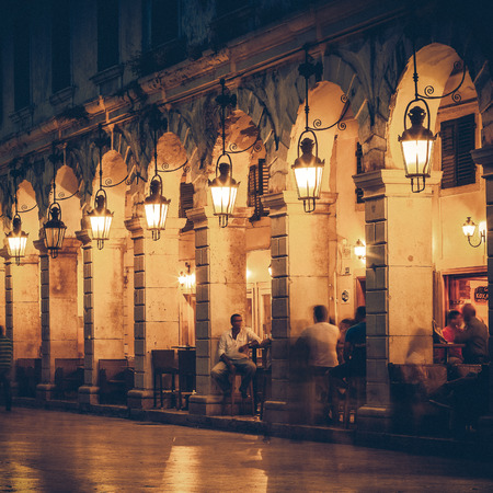 Liston street at night on Corfu island, Greece - vintage coasterのeditorial素材