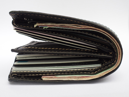 over use black wallet on white backgroundの写真素材