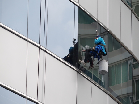 man cleaning glass buildingの写真素材