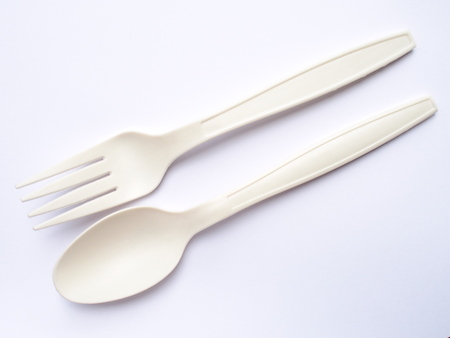 bio plastic spoons and forks on white backgroundの写真素材