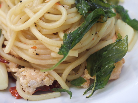 spicy spaghetti with sour pork sausageの写真素材