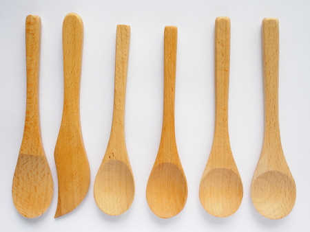 set of four beech wood tea spoon on white backgroundの写真素材