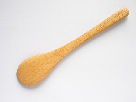 back side of beech wood tea spoon on white backgroundの写真素材