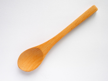 beech wood tea spoon on white backgroundの写真素材