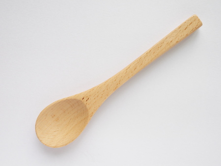 beech wood tea spoon on white backgroundの写真素材