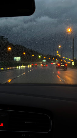 Driving on the highway in the rain. View from inside the car.の写真素材