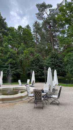 Garden with tables and chairs in the park of a European cityの写真素材