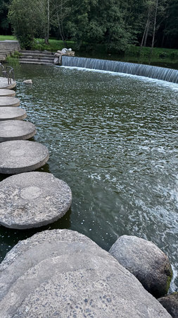 Small lake in the park with stone stairs and waterfalls. Toned.の写真素材