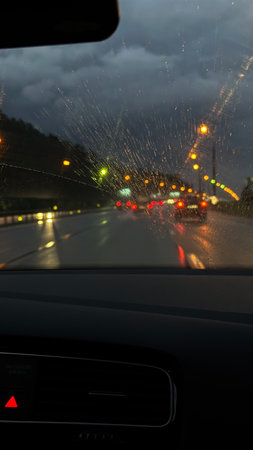 Driving on a rainy day through the windshield of a car.の写真素材
