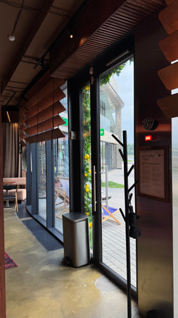 Interior of a restaurant with a door and a glass door.の写真素材