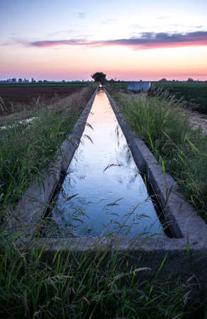 Concrete irrigation canal at sunset. Low Guadiana Lands, Extremadura, Spainの写真素材