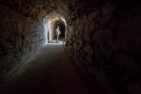 Child girl at Merida Roman theater grandstand access corridor. One of the largest and most extensive...