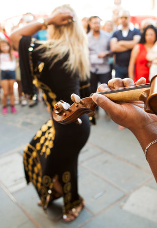 BADAJOZ, SPAIN - SEPTEMBER 27: Belly dancer performance with arabic music street band at the Almossassa Festival on September 27, 2015 in Badajoz, Spainのeditorial素材