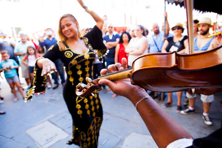 BADAJOZ, SPAIN - SEPTEMBER 27: Belly dancer performance with arabic music street band at the...