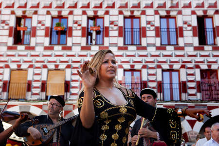 BADAJOZ, SPAIN - SEPTEMBER 27: Belly dancer performance with arabic music street band at the Almossassa Festival on September 27, 2015 in Badajoz, Spainのeditorial素材