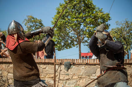 Badajoz, Spain - Seot 28th, 2019: Medieval moorish reenactors performing sword combat. Almossasa Culture Festival of Badajoz, Spainのeditorial素材
