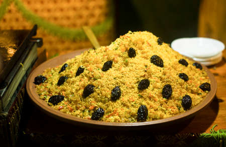 Large bowl of couscous with dried plumsの写真素材
