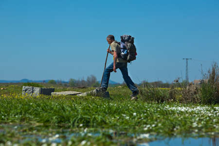 VALDESALOR, CACERES, SPAIN - MARCH 20: Unidentified pilgrim walking through fields of Silver Way -Via de la Plata- Valdesalor, Caceres, Extremadura, Spain on March 20, 2011のeditorial素材