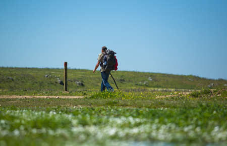 Pilgrim walking through fields of Silver Way -Via de la Plata- Valdesalor, Caceres, Extremadura, Spainのeditorial素材