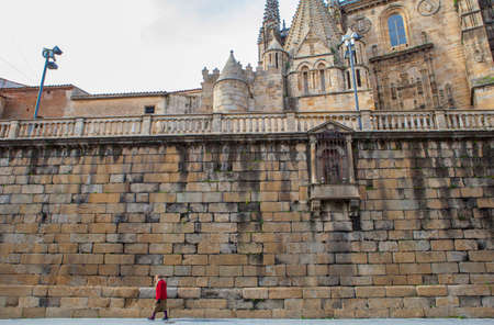 Plasencia, Spain - February 15, 2017: Elder woman walking by Plasencia Old Town, close to Old Cathedral, Caceres, Extremadura, Spainのeditorial素材
