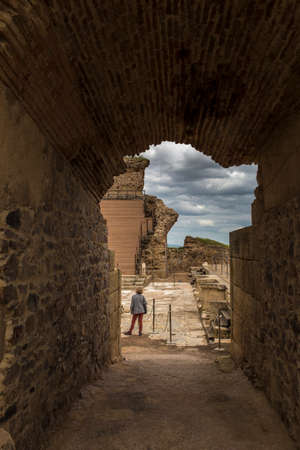 Medellin, Spain - April 28th, 2018: Roman theater of Medellin. Visitor woman under side arch entry, Extremadura, Spainのeditorial素材