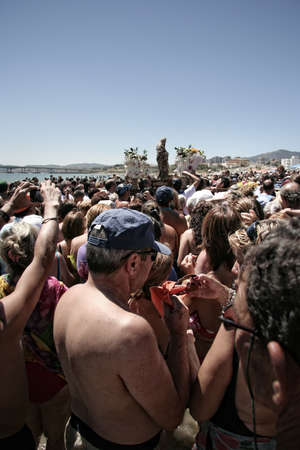 Algeciras, Spain - August 15th, 2008: Unidentified people taking part on the Palm Virgin procession. Divers and fishermen of Algeciras bring Palma Virgin out of her underwater home and parade her about town. Algeciras, August 15th, 2008のeditorial素材