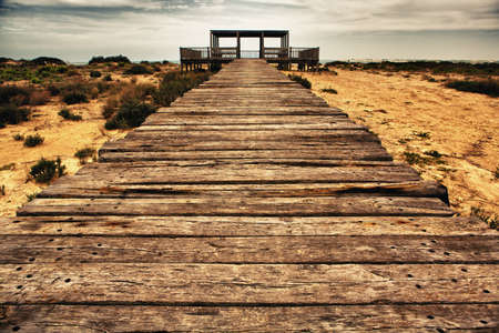 Wooden footbridge structures at Cadiz rivermouth beaches, Spainの写真素材