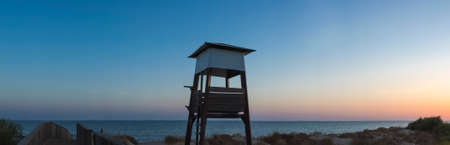 Life guard tower at sunset close to Islantilla beach, -huelva, Costa de la Luz, Spainのeditorial素材