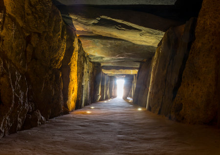 Trigueros, Spain - July 2nd, 2018: Sun rays entering at Dolmen de Soto chamber. Sun-aligned megalithic monument, Trigueros, Huelva, Spainのeditorial素材