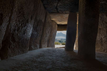 Antequera, Spain - July 10th, 2018: Dolmen of Menga, Antequera. Interior chamber pointing to Pena de los Enamorados mountainのeditorial素材