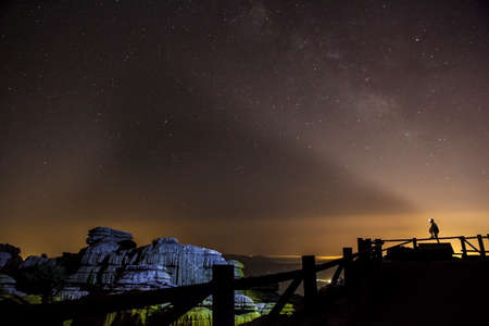 Starry sky background at night in El Torcal de Antequera natural park, Andalusia, Spain. Some of...