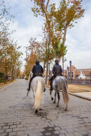 Seville, Spain - January 3, 2017: Mounted police at Plaza de Espana, Seville, Spainのeditorial素材