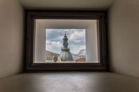 Cartagena, Spain - September 14th, 2018: Cartagena Town Hall Tower through the Museum of the Roman Theater of Cartagena window, Murcia, Spainのeditorial素材