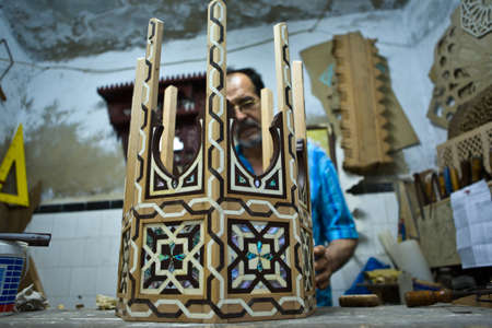 TETOUAN, MOROCCO - AUGUST 17: Unidentified man works with wood to create artwork on August 17, 2014 in Tetouan, Moroccoのeditorial素材